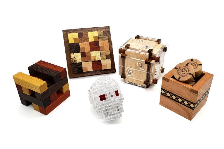 New mechanical interlocking packing puzzles and puzzle boxes