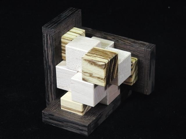 Metal puzzles for adults, 3D puzzles, and physical brain teasers by CubicDissection.